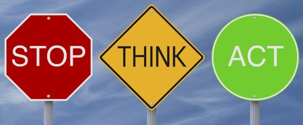 photo of road signs with stop think act text